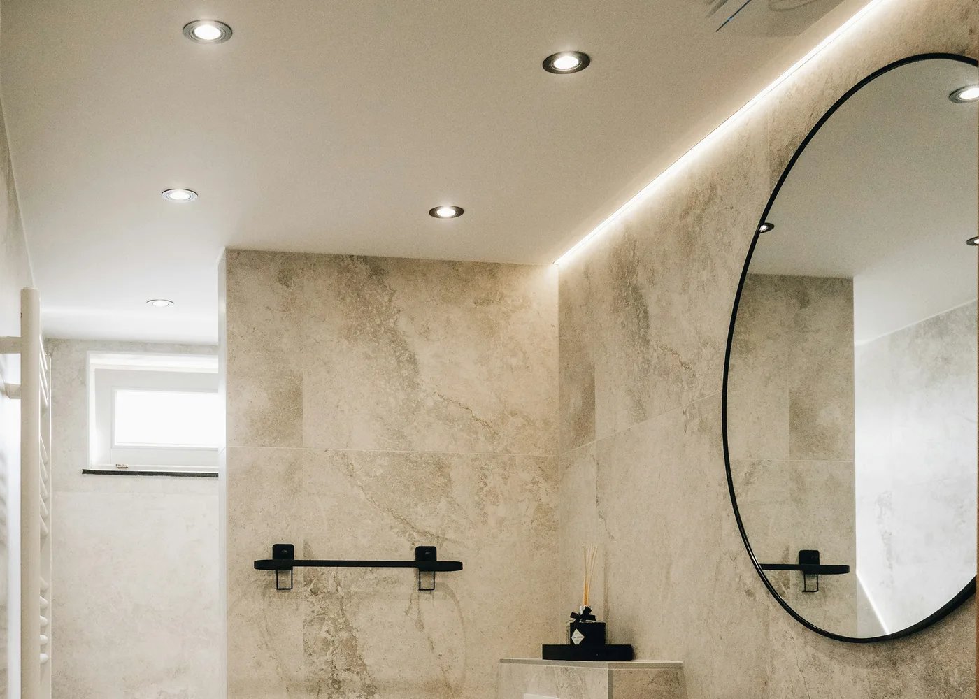 Period bathroom renovation with roll-top bath and marble splash in Ilkley